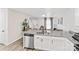 Granite countertop island with a stainless steel dishwasher overlooks the living room at 355 Jared Steel Ln, Salisbury, NC 28146
