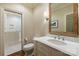 Elegant bathroom featuring a marble vanity, classic fixtures, and a glass-enclosed shower, designed for comfort and style at 3950 Abingdon Rd, Charlotte, NC 28211