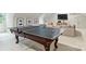 Spacious game room with a pool table and comfortable seating, perfect for entertaining and relaxing at 3950 Abingdon Rd, Charlotte, NC 28211