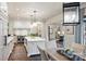 Stylish kitchen with white cabinets, a large island, stainless steel appliances, and hardwood floors at 3950 Abingdon Rd, Charlotte, NC 28211