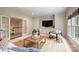 Cozy living area with built-in entertainment center and access to an upper level at 3950 Abingdon Rd, Charlotte, NC 28211