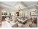 Spacious living room with a coffered ceiling, comfortable seating, and access to the kitchen at 3950 Abingdon Rd, Charlotte, NC 28211