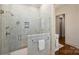 Elegant glass-enclosed shower with marble tile, dual shower heads, and stylish fixtures at 3950 Abingdon Rd, Charlotte, NC 28211