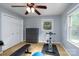Bright bedroom featuring a ceiling fan, natural light, and workout equipment at 4145 Wrangler Sw Dr, Concord, NC 28027
