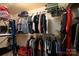Walk-in closet with ample storage, hanging racks, and organized clothing at 4145 Wrangler Sw Dr, Concord, NC 28027
