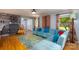 Comfortable living room with hardwood floors, stylish decor, and ample natural light at 4145 Wrangler Sw Dr, Concord, NC 28027