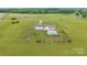 Aerial view of a beautiful home with a pool, manicured landscaping, and a spacious yard at 4316 Nesbit Rd, Monroe, NC 28112