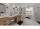 Bright bathroom with double vanity, soaking tub, and separate shower, offering a spa-like experience at 4316 Nesbit Rd, Monroe, NC 28112
