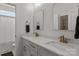 Bright bathroom featuring a double vanity with Carrara marble counters and brushed gold fixtures at 4316 Nesbit Rd, Monroe, NC 28112