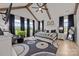 Spacious bedroom featuring high ceilings, exposed beams, large windows, and a luxurious bed at 4316 Nesbit Rd, Monroe, NC 28112
