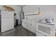 Functional kitchen with white cabinets, marble counters, and modern appliances at 4316 Nesbit Rd, Monroe, NC 28112