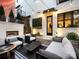 Charming backyard with a brick fireplace, stylish seating, vertical garden, and string lights for relaxed outdoor living at 443 Beaumont Ave, Charlotte, NC 28204