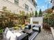Cozy backyard patio with an outdoor fireplace and stylish furniture, perfect for entertaining at 443 Beaumont Ave, Charlotte, NC 28204