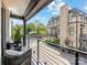 Spacious balcony offering picturesque views of a well-maintained street and neighboring brick buildings at 443 Beaumont Ave, Charlotte, NC 28204
