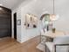 Dining area with modern light fixture, hardwood floors, and views into adjacent rooms at 443 Beaumont Ave, Charlotte, NC 28204