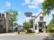 White home with black trim on a corner lot showcasing professional landscaping and mature trees at 443 Beaumont Ave, Charlotte, NC 28204