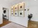 Bright hallway with hardwood floors, recessed lighting, framed wall art and entry to other rooms at 443 Beaumont Ave, Charlotte, NC 28204