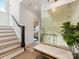 Inviting hallway with hardwood floors, wood stairs, decorative mirror, and access to other rooms at 443 Beaumont Ave, Charlotte, NC 28204