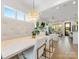 Open living space featuring a dining table and seating area, showcasing a bright and airy design at 443 Beaumont Ave, Charlotte, NC 28204