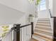 Bright staircase with white risers and wood treads, enhanced by natural light and stylish design at 443 Beaumont Ave, Charlotte, NC 28204
