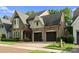 Side exterior view showing the brickwork, rooflines and attached two car garage at 4635 Harper Ct, Charlotte, NC 28210