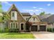Beautifully maintained brick home featuring a three-car garage, well-kept lawn, and professional landscaping at 4635 Harper Ct, Charlotte, NC 28210