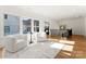 Bright hallway featuring hardwood floors, transom windows, and comfortable seating at 4635 Harper Ct, Charlotte, NC 28210