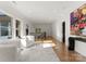 Bright, expansive hallway with hardwood flooring, transom windows, and a view of the staircase at 4635 Harper Ct, Charlotte, NC 28210