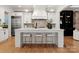 Modern kitchen featuring white cabinetry, quartz countertops, and stainless steel appliances at 4635 Harper Ct, Charlotte, NC 28210