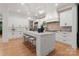 Spacious kitchen features a large center island with seating, white cabinets, and modern finishes at 4635 Harper Ct, Charlotte, NC 28210