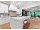 Bright kitchen features a center island with seating, pendant lighting, and stainless steel appliances at 4635 Harper Ct, Charlotte, NC 28210