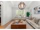 Comfortable living room with natural light, stylish furniture, and a contemporary chandelier at 4635 Harper Ct, Charlotte, NC 28210