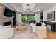 Living room features large windows, fireplace, and stylish furnishings at 4635 Harper Ct, Charlotte, NC 28210