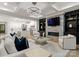 Open concept living room with fireplace, hardwood floors, and abundant natural light at 4635 Harper Ct, Charlotte, NC 28210