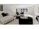 Inviting living room with a plush white sectional sofa, modern accents, and bright lighting at 4635 Harper Ct, Charlotte, NC 28210