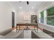 Modern home office with a spacious desk, comfortable seating, and natural light at 4635 Harper Ct, Charlotte, NC 28210