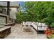 Outdoor living space showcasing stone patio, fire pit, and comfortable sectional seating at 4635 Harper Ct, Charlotte, NC 28210
