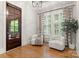 Cozy sitting room featuring hardwood floors, shutters, and comfortable seating at 4635 Harper Ct, Charlotte, NC 28210