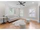 Bright room featuring hardwood floors, shutters, comfortable seating, and bay windows at 4635 Harper Ct, Charlotte, NC 28210