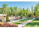 Bocce ball court and outdoor area with tables and chairs, perfect for recreation and relaxing by the pool at 5104 Samoa Ridge Dr, Lancaster, SC 29720