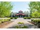 Exterior of stylish clubhouse with beautiful landscaping, offering a welcoming entrance and curb appeal at 5104 Samoa Ridge Dr, Lancaster, SC 29720