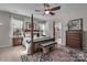 Comfortable primary bedroom with a four-poster bed, stylish furnishings, and an en-suite bathroom entrance at 5104 Samoa Ridge Dr, Lancaster, SC 29720