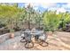 Outdoor patio with a round table, six chairs, and well-maintained landscaping, perfect for entertaining at 5104 Samoa Ridge Dr, Lancaster, SC 29720