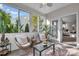 Bright sunroom featuring comfortable seating, neutral tones and a view of the outdoors leading to the bedroom at 5104 Samoa Ridge Dr, Lancaster, SC 29720