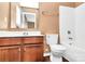 Bathroom featuring white fixtures, wood cabinets and tile flooring at 5146 Elementary View Dr, Charlotte, NC 28269