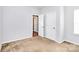 The carpeted bedroom has natural light and features neutral walls with two entryways at 5146 Elementary View Dr, Charlotte, NC 28269