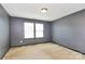 Bedroom featuring neutral carpet, gray walls, and natural light at 5146 Elementary View Dr, Charlotte, NC 28269
