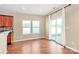 An open living space includes hardwood floors, natural lighting, and sliding glass door to the patio at 5146 Elementary View Dr, Charlotte, NC 28269