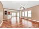 This open living area features hardwood floors and natural light, connecting the kitchen and dining area at 5146 Elementary View Dr, Charlotte, NC 28269
