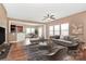 The modern living room has neutral tones with hardwood floors, natural light, and connecting the dining and kitchen area at 5146 Elementary View Dr, Charlotte, NC 28269